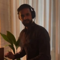 DJ Ritz playing a set with headphones on